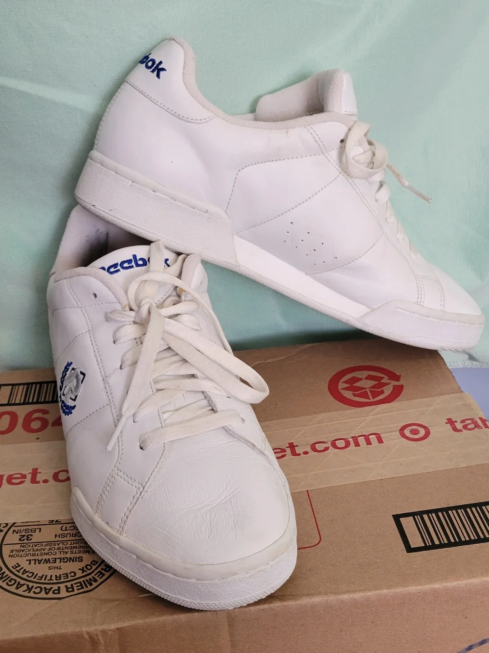 Reebok Men’s Classic White Leather Sneakers with Blue Accents